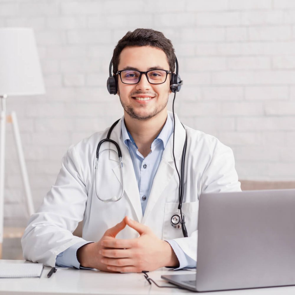 health-blog-young-doctor-in-headphones-sitting-at-2023-11-27-04-51-23-utc-1.jpg