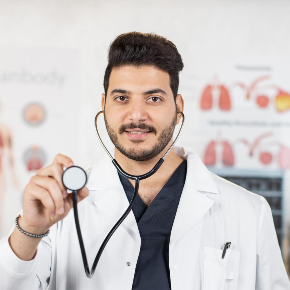 indian-doctor-holding-stethoscope-and-smiling-on-c-2023-11-27-05.jpg
