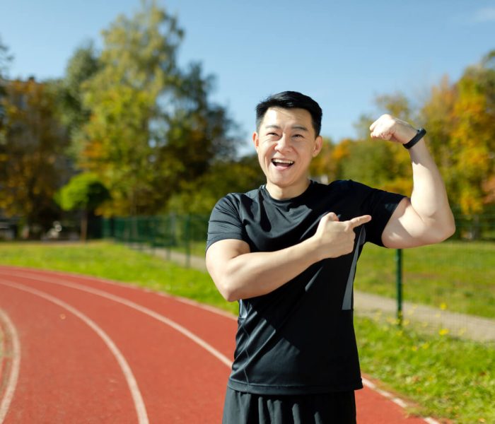 portrait-of-asian-young-male-athlete-standing-on-s-2023-11-27-05-06-38-utc-1.jpg
